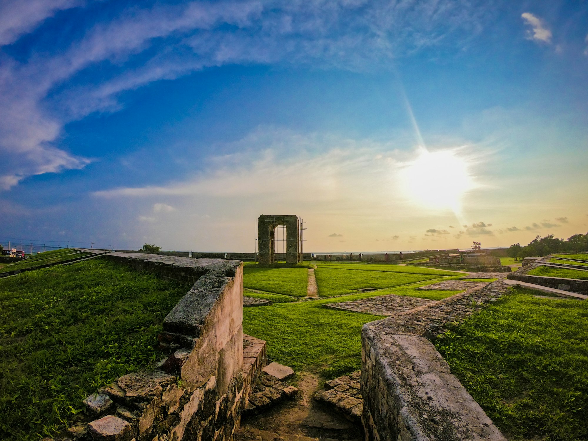 An old stone gateway arch in a colonial-era fort wall