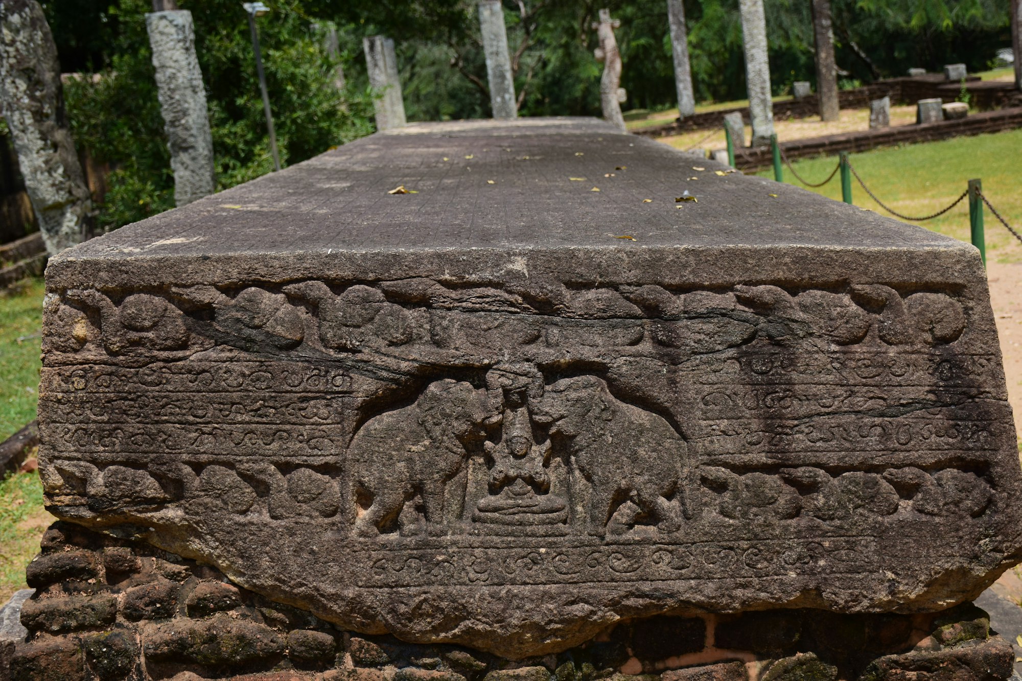 A carved stone semicircle set into the threshold of a shrine