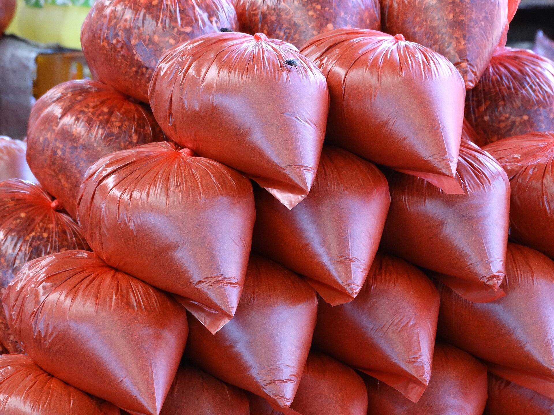 Open sacks of spices lined up at a market stall in the Pettah district of Colombo.